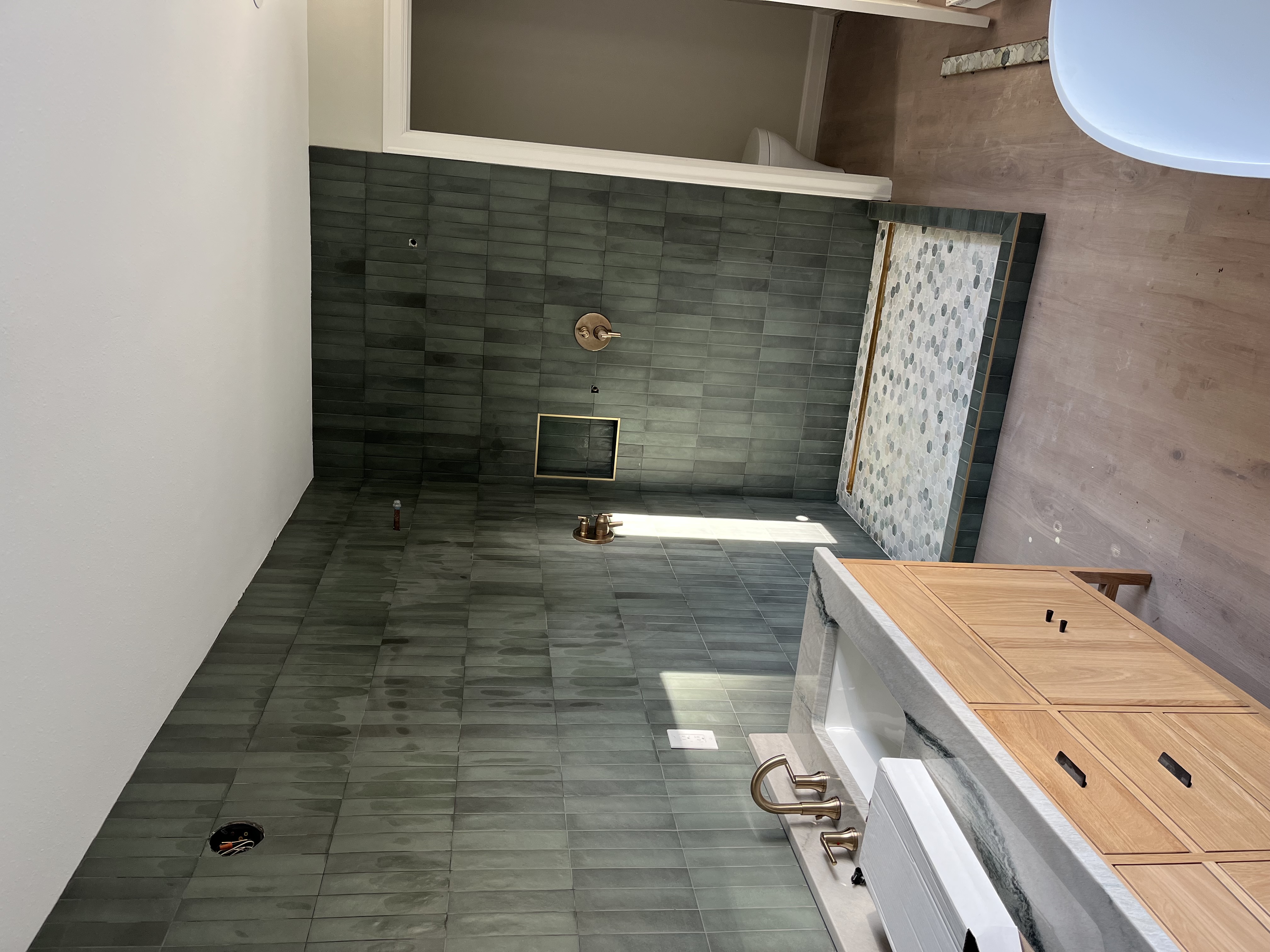 Deep green zellige master bath